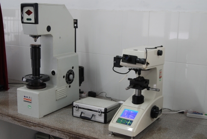 Quality inspector using precision measuring instrument to check CV joint